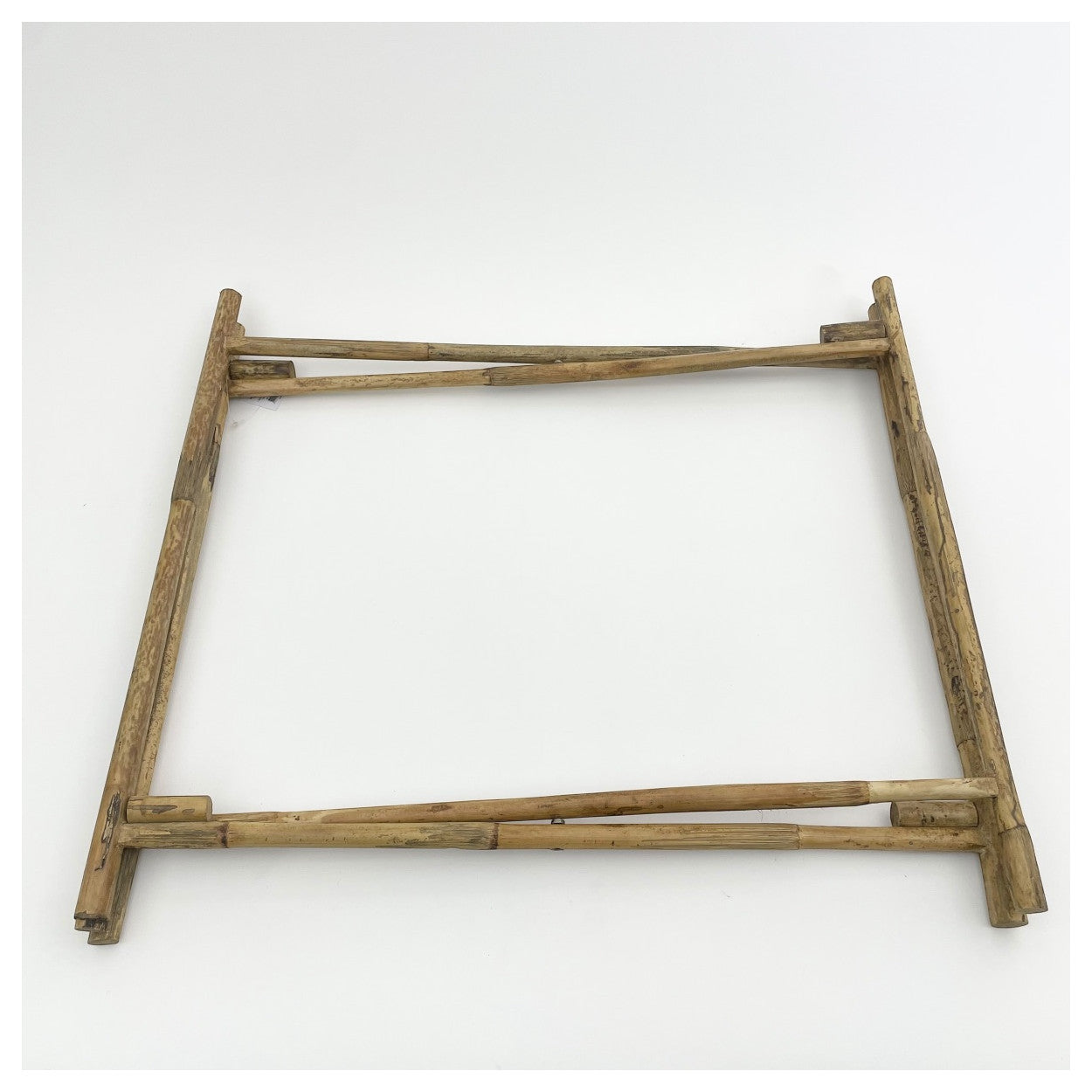 Bamboo table stand shown folded down.