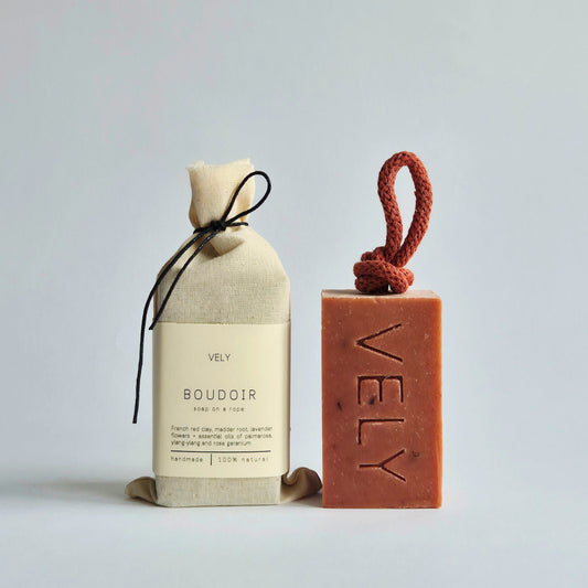 Pink coloured soap on a rope scented with lavender flowers, ylang-ylang and rose geranium.