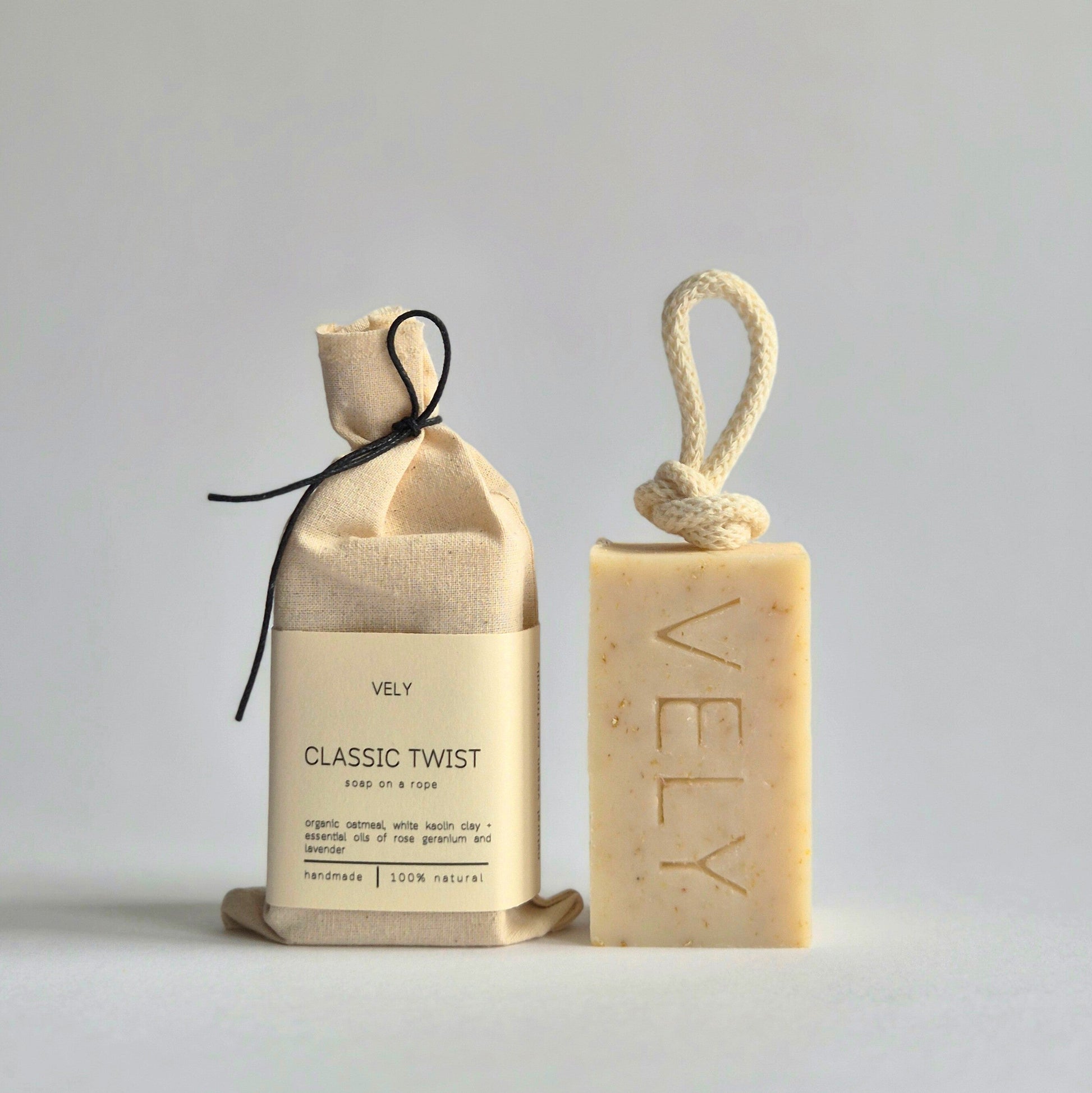 Natural coloured soap on a rope made from oatmeal, white kaolin clay and rose geranium.