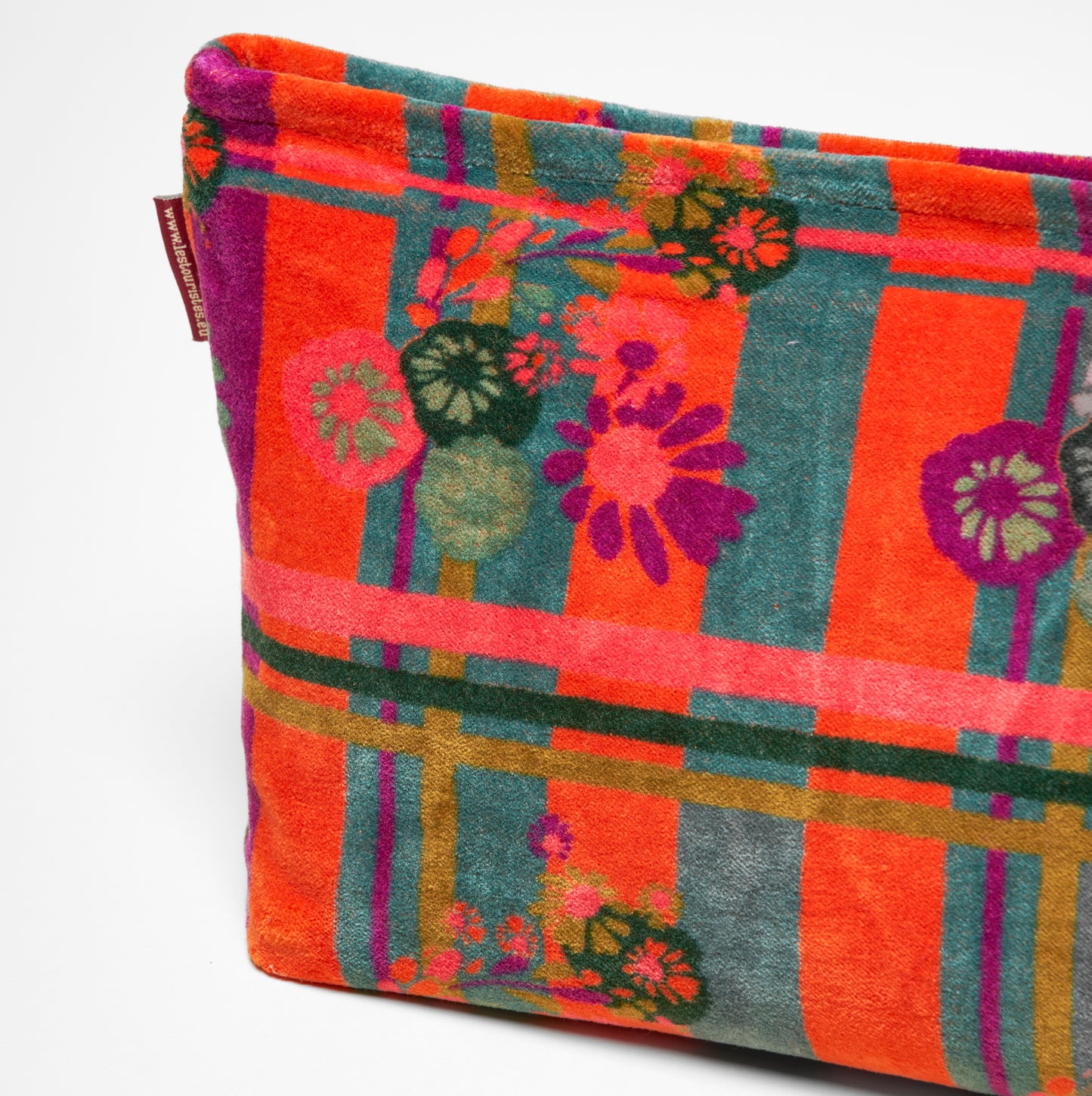 Orange, teal and purple striped and floral patterned cotton velvet washbag.