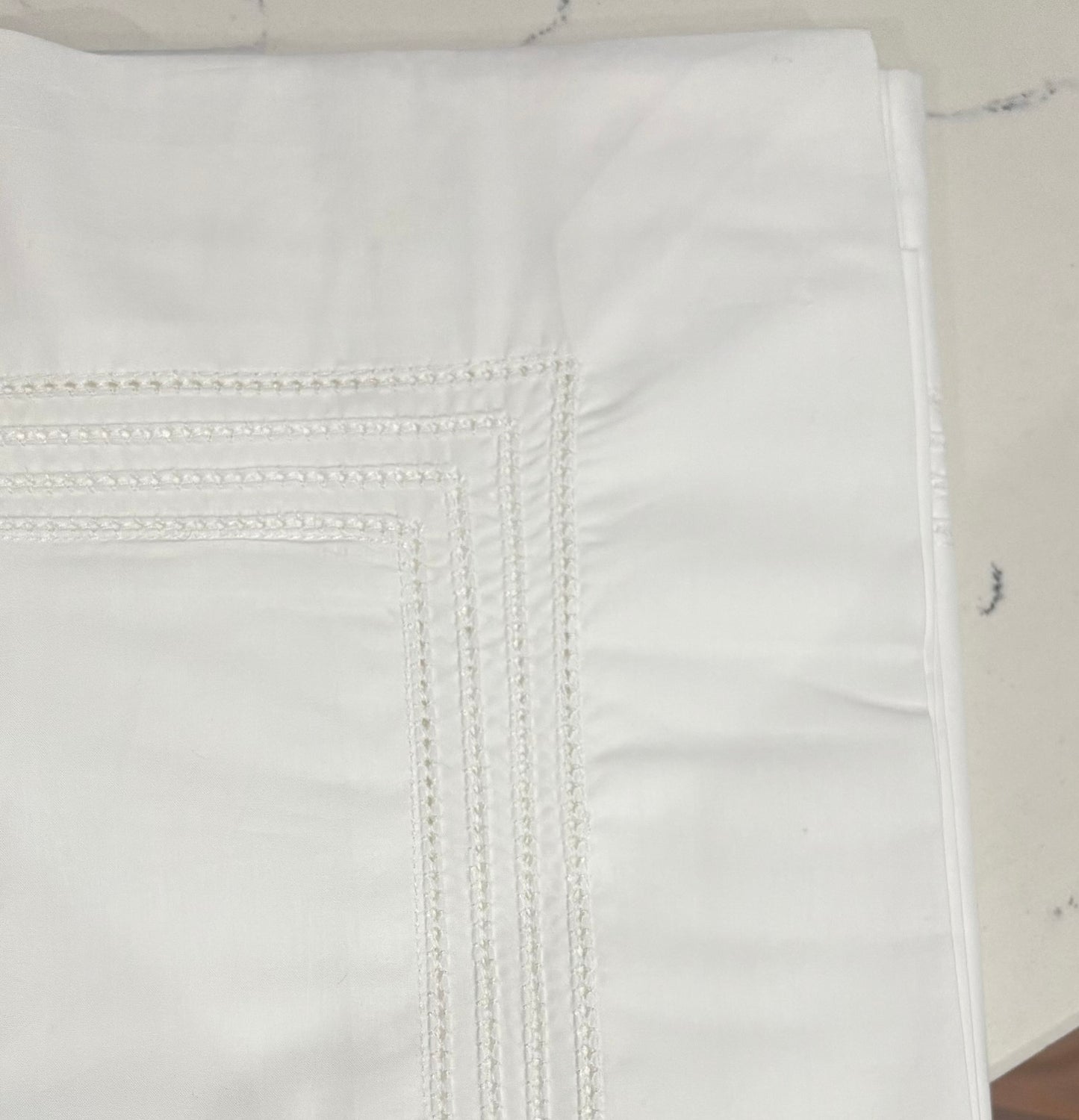 Close up image of the pillowcase showering the royale 4 row hemstitching detailing.