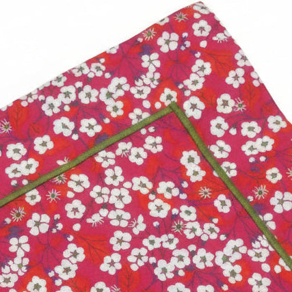 Zoomed in image of liberty mitsi square pillowcase showing the green cording finishing edge.