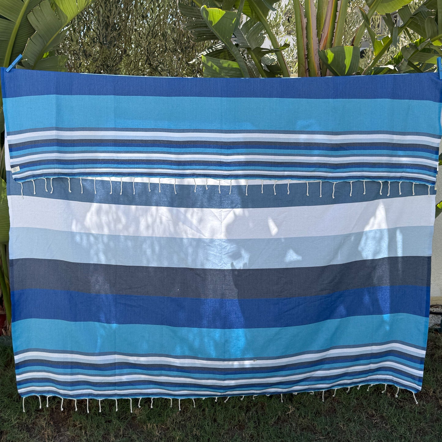 Blue stripes double fouta beach towel, in different shades of blue.
