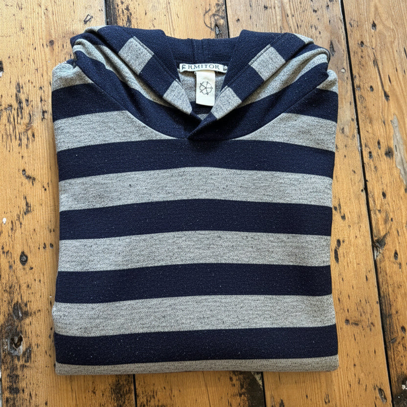 Folded blue and navy striped swim robe.