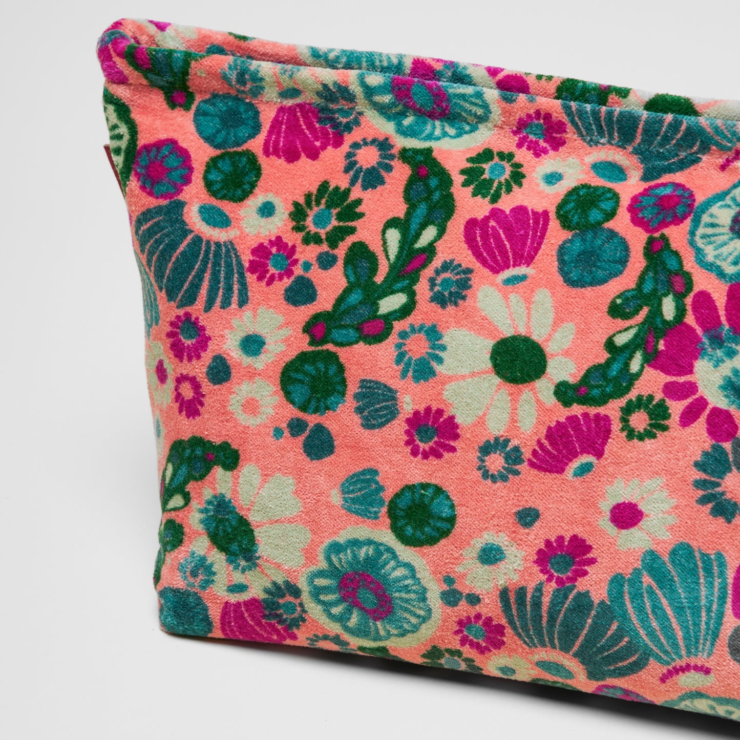 Cotton velvet light pink washbag with a teal, green and magenta floral design.