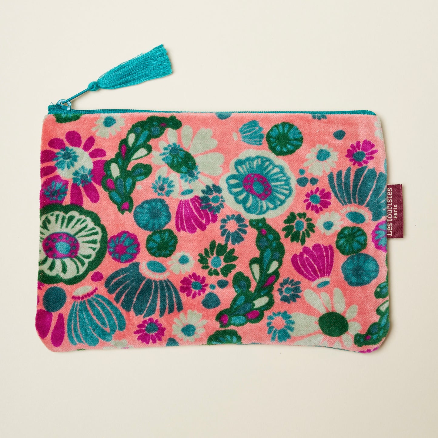 Cotton velvet pouch with a light pink base with teal, green and magenta floral design.