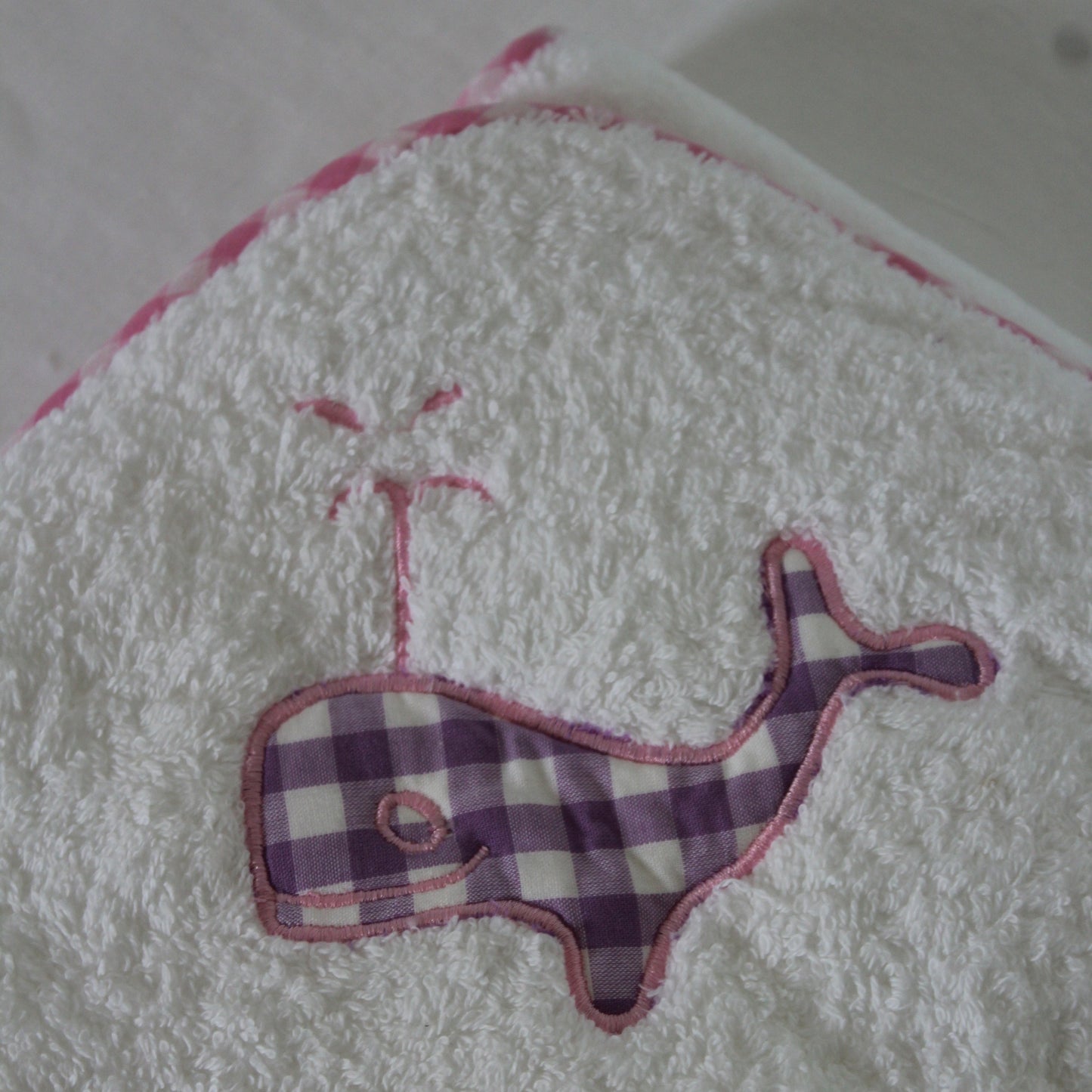 Plaid animal design on a textured white surface