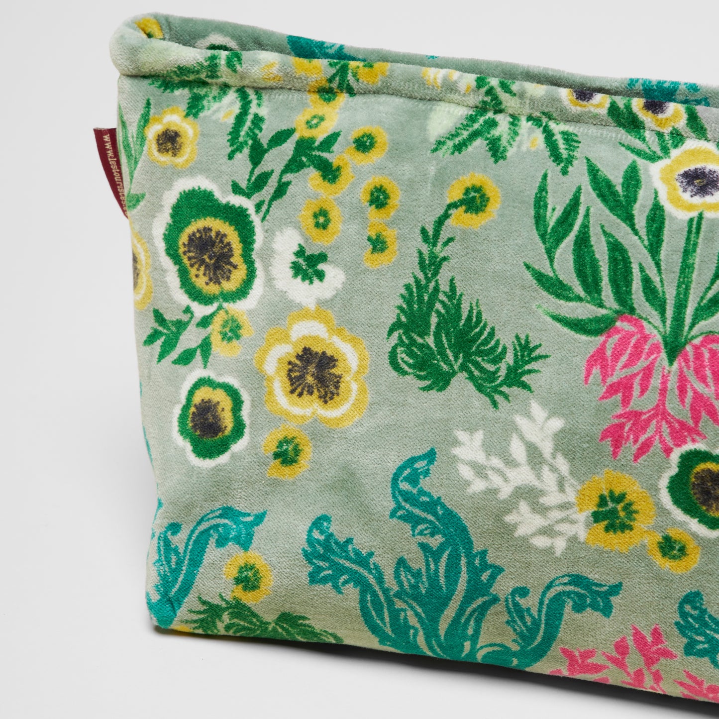 Cotton velvet sage washbag with yellow, green, teal and pink wild flower patterns.
