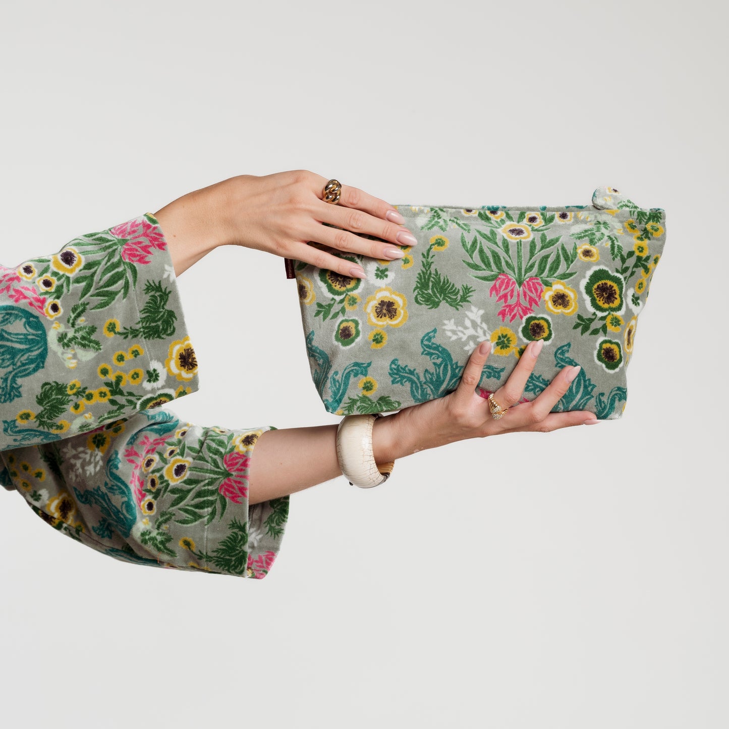 Sage green cotton velvet wild flower patterned washbag.