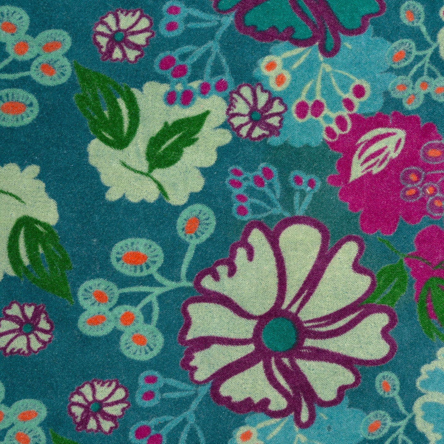 Purple, blue and green floral patterned teal based cotton velvet.