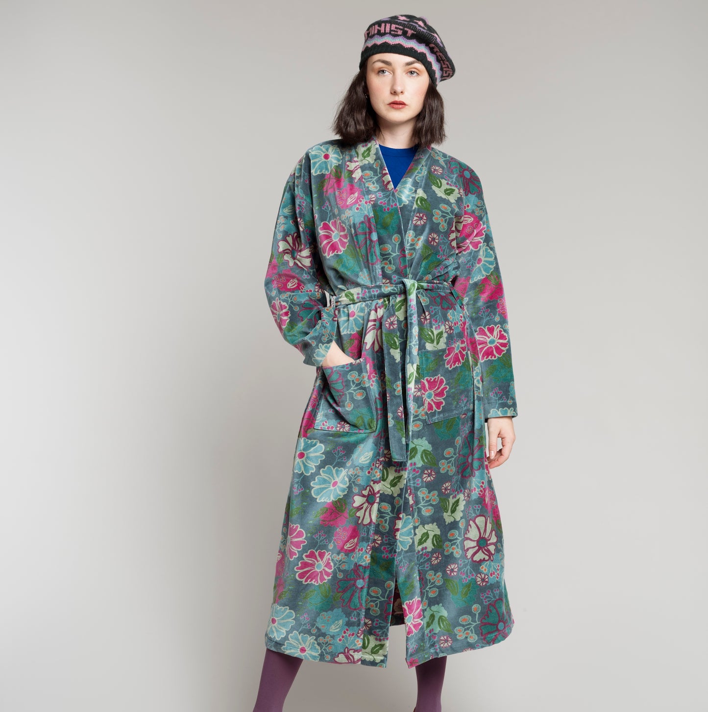 Cotton velvet teal robe with a multi colour floral pattern.