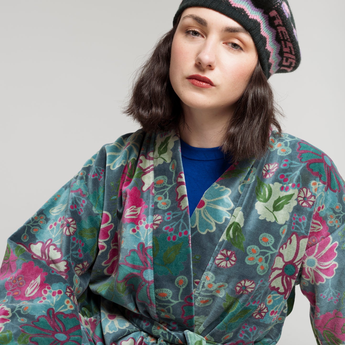 Teal cotton velvet robe with a green, magenta and blue floral pattern.