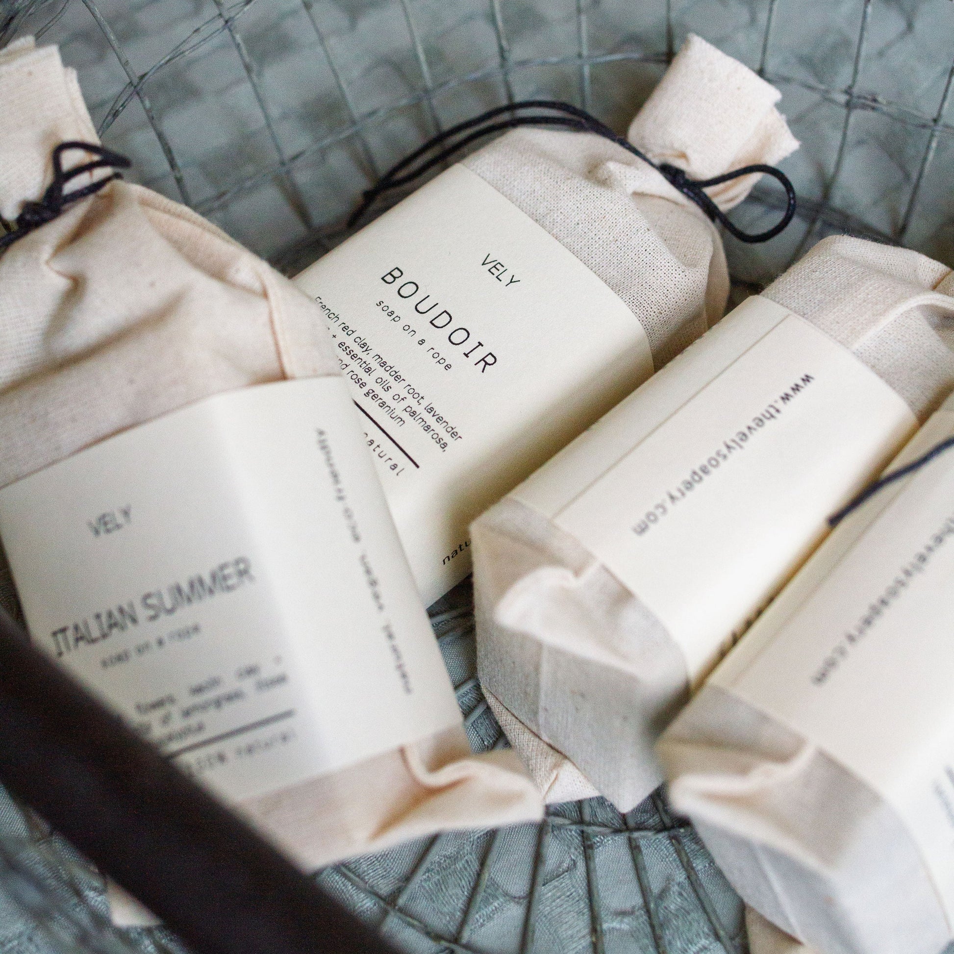 Vely soaps in a cloth bag.