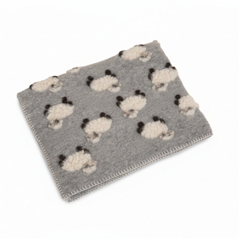 Grey boiled wool baby blanket patterned with lambs.