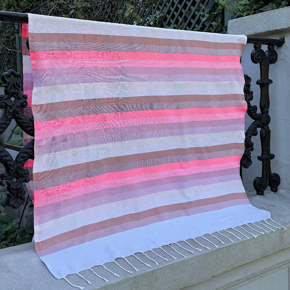 Neon pink fouta towel for the beach