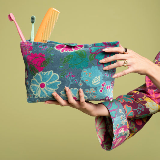 Teal cotton velvet washabag with a blue, green and purple floral pattern.