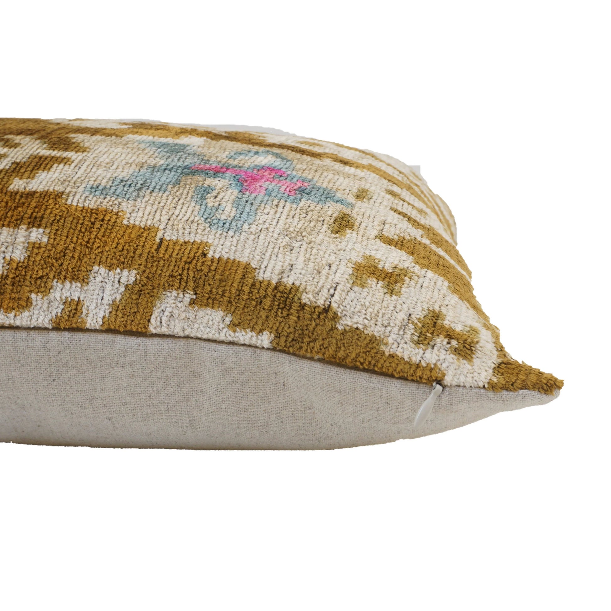 Dark gold kelim patterned cushion cover showing the side of the cushion highlighting the cotton back of the cushion cover.