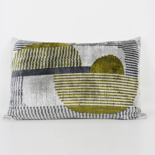 Silk velvet silver cushion with blue and green geometric patterns throughout the cushion.