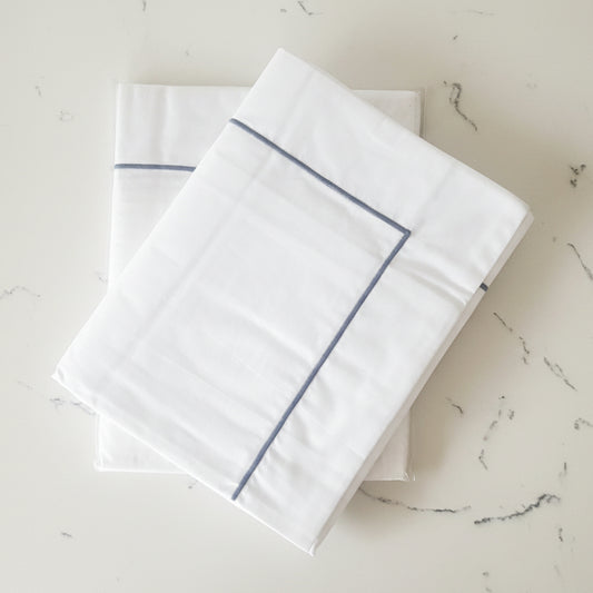 Grey corded detailed white king oxford pillowcases.