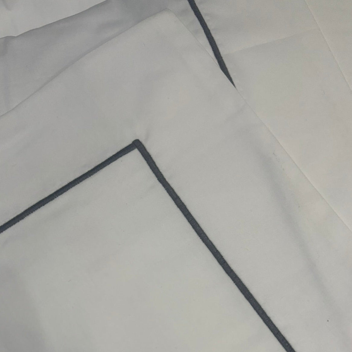 Single grey corded king white pillowcase.