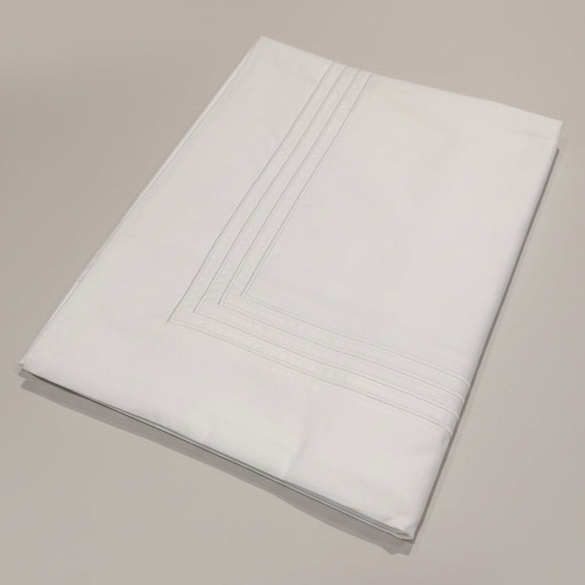 White 4 row cord stitching on a white oxford pillowcase.