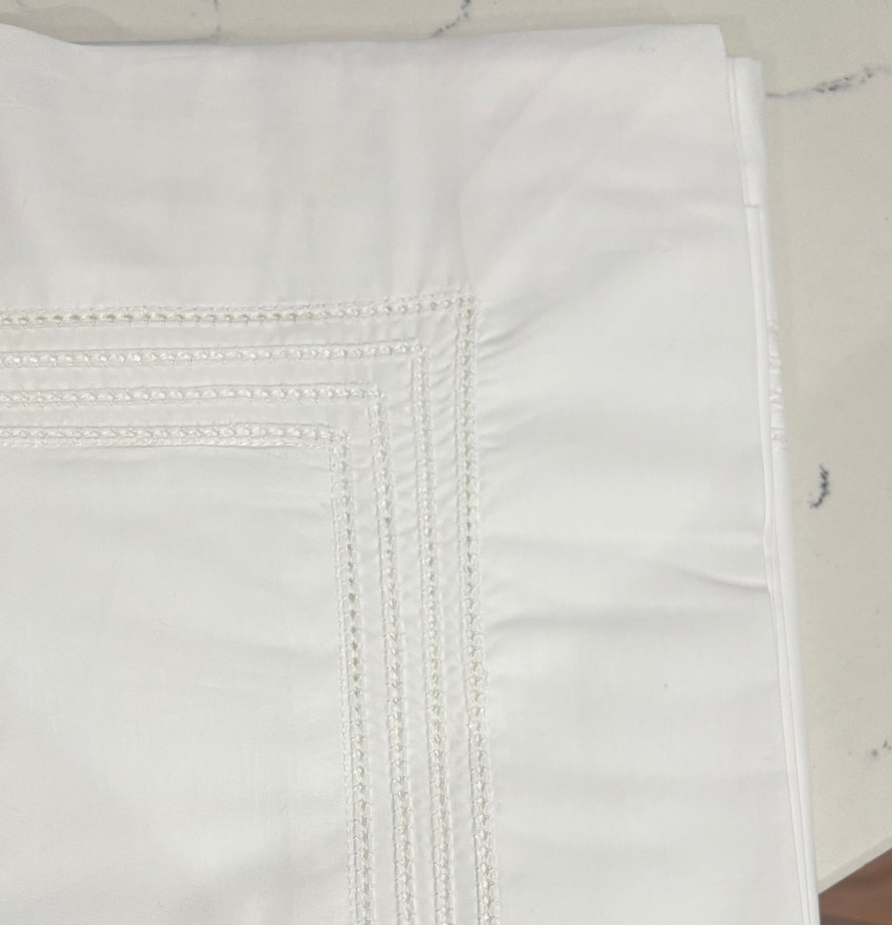 Close up image of the pillowcase showering the royale 4 row hemstitching detailing.