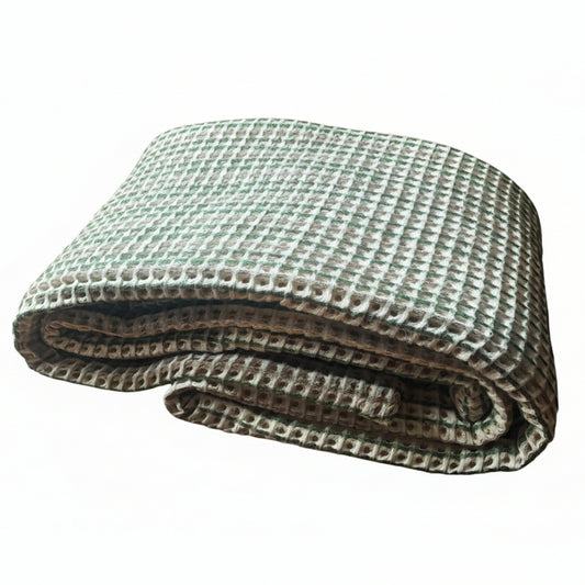 Coloured waffle bedspread.