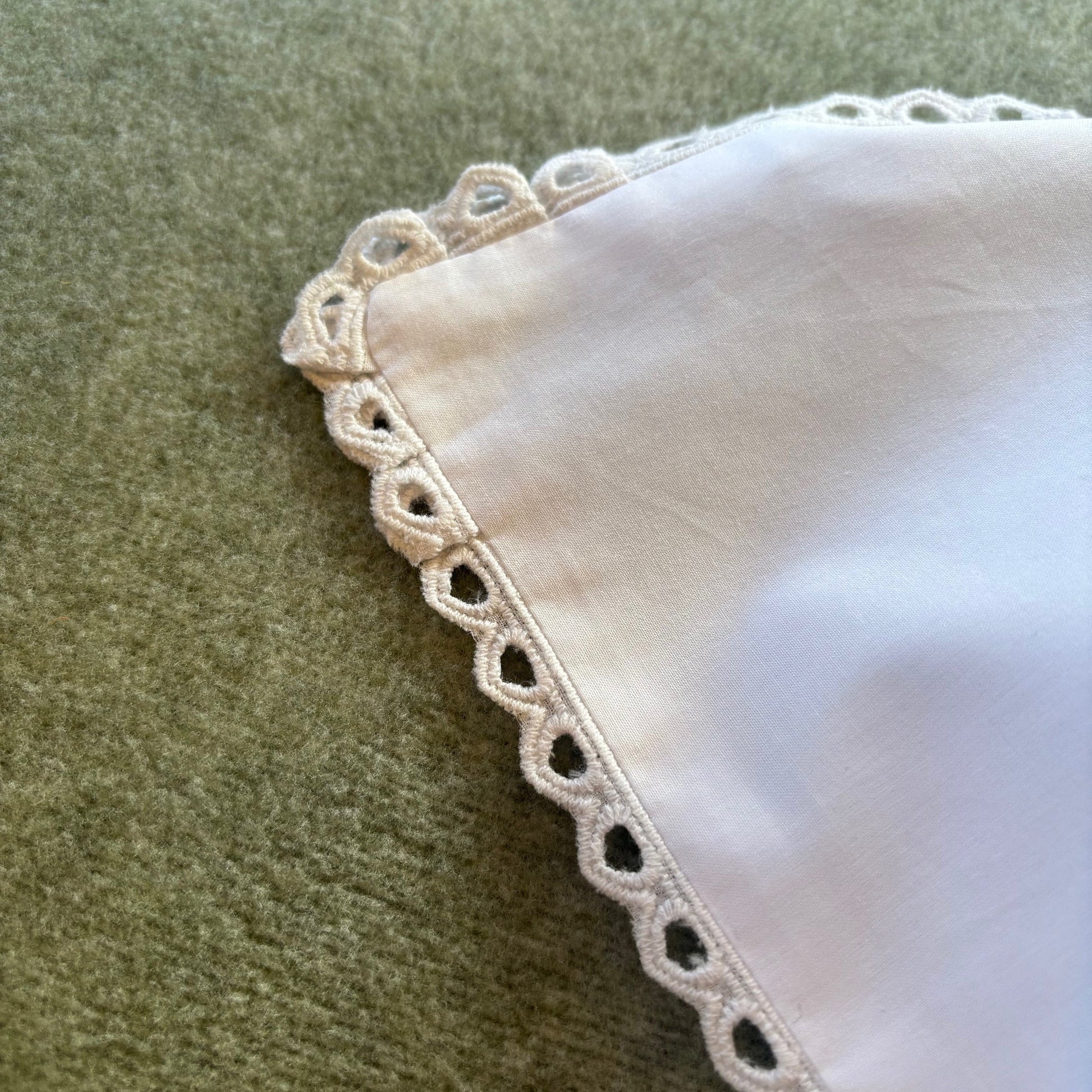 Cutwork edged pillowcase in white.