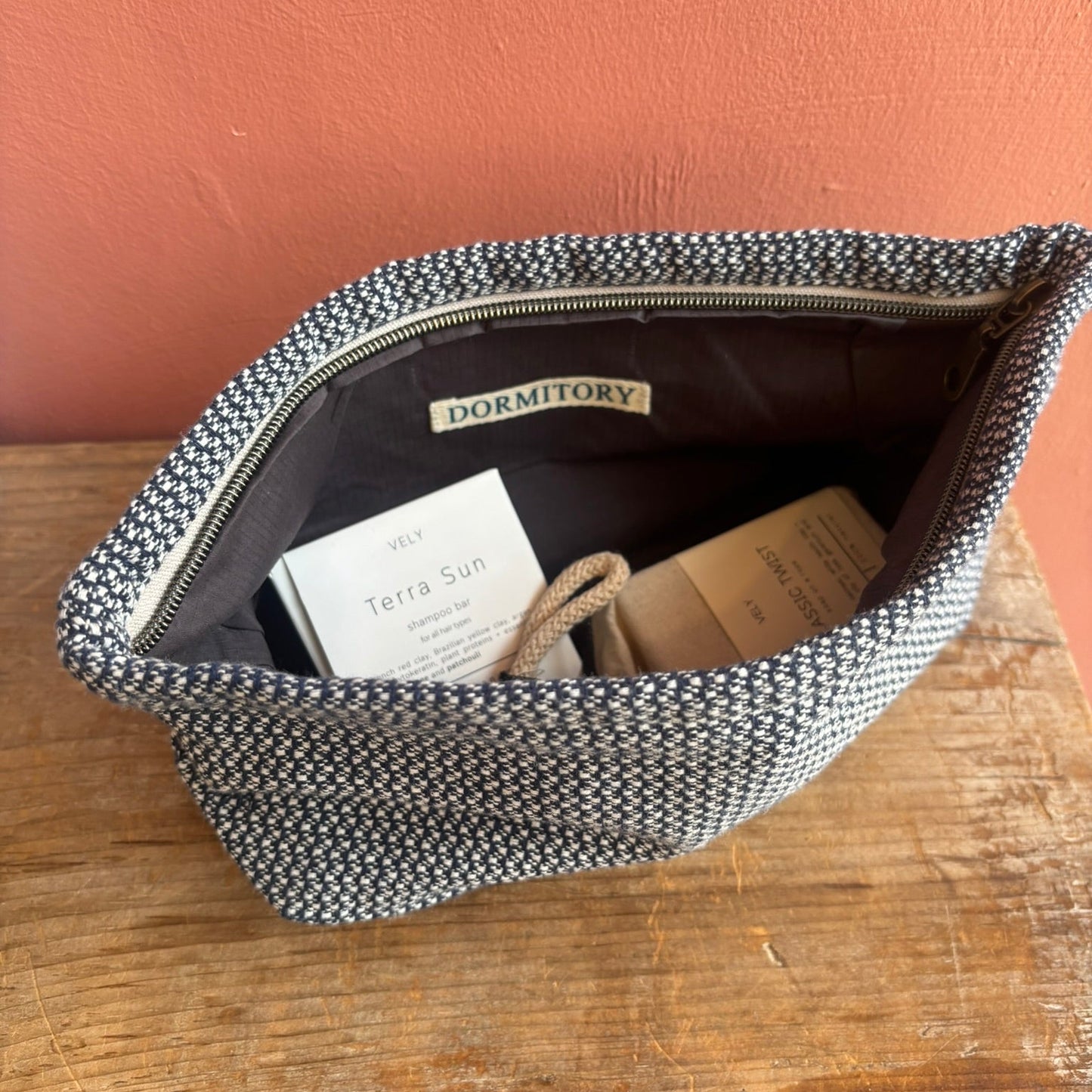 navy and white lined washbag