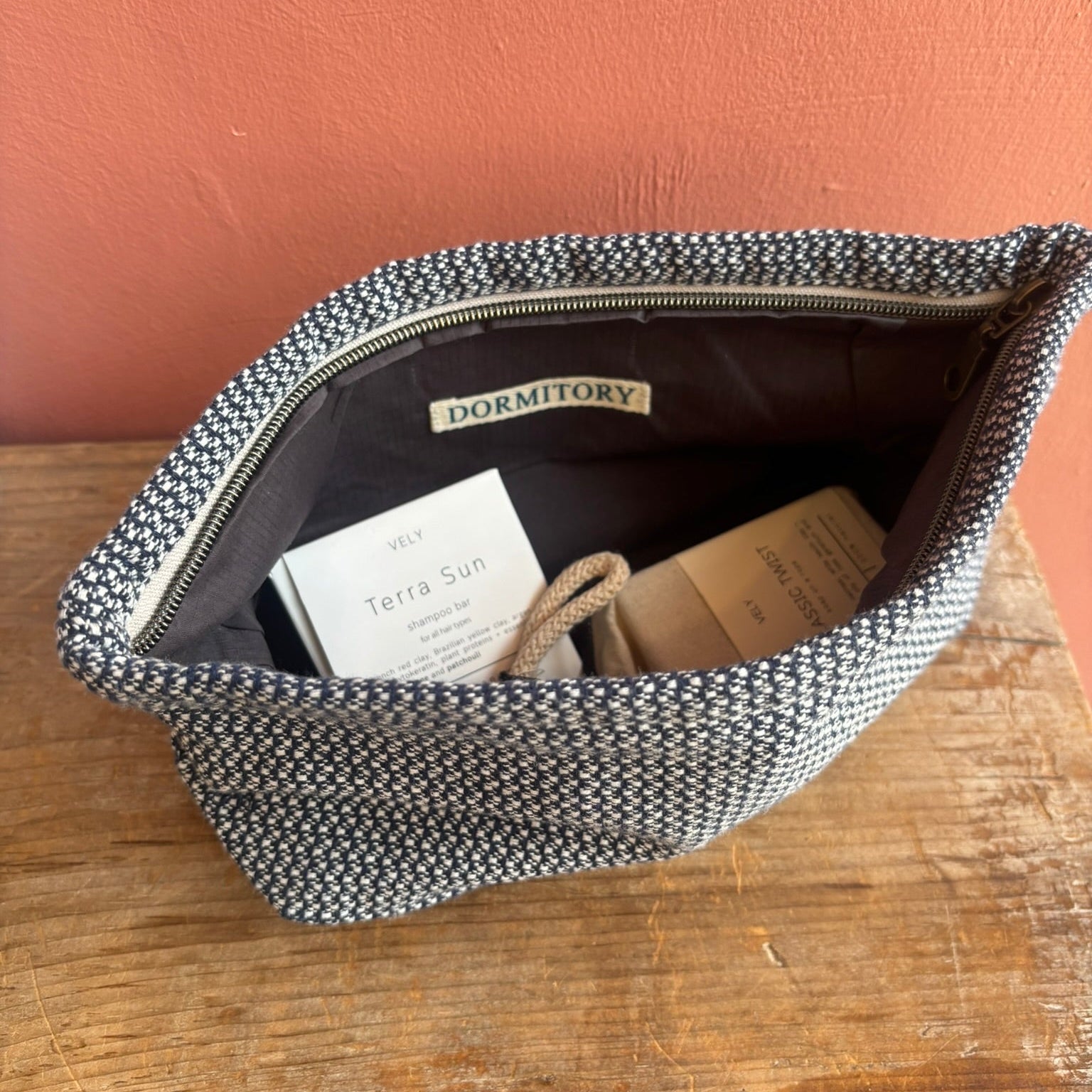 navy and white lined washbag