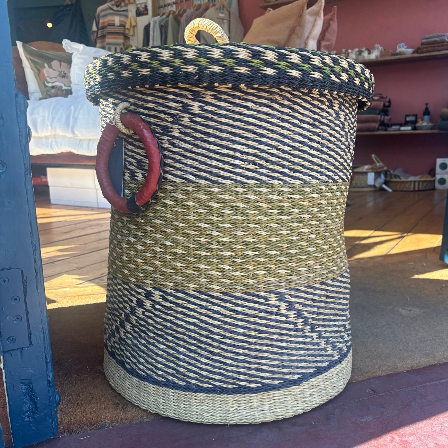 olive green and black large woven laundry basket