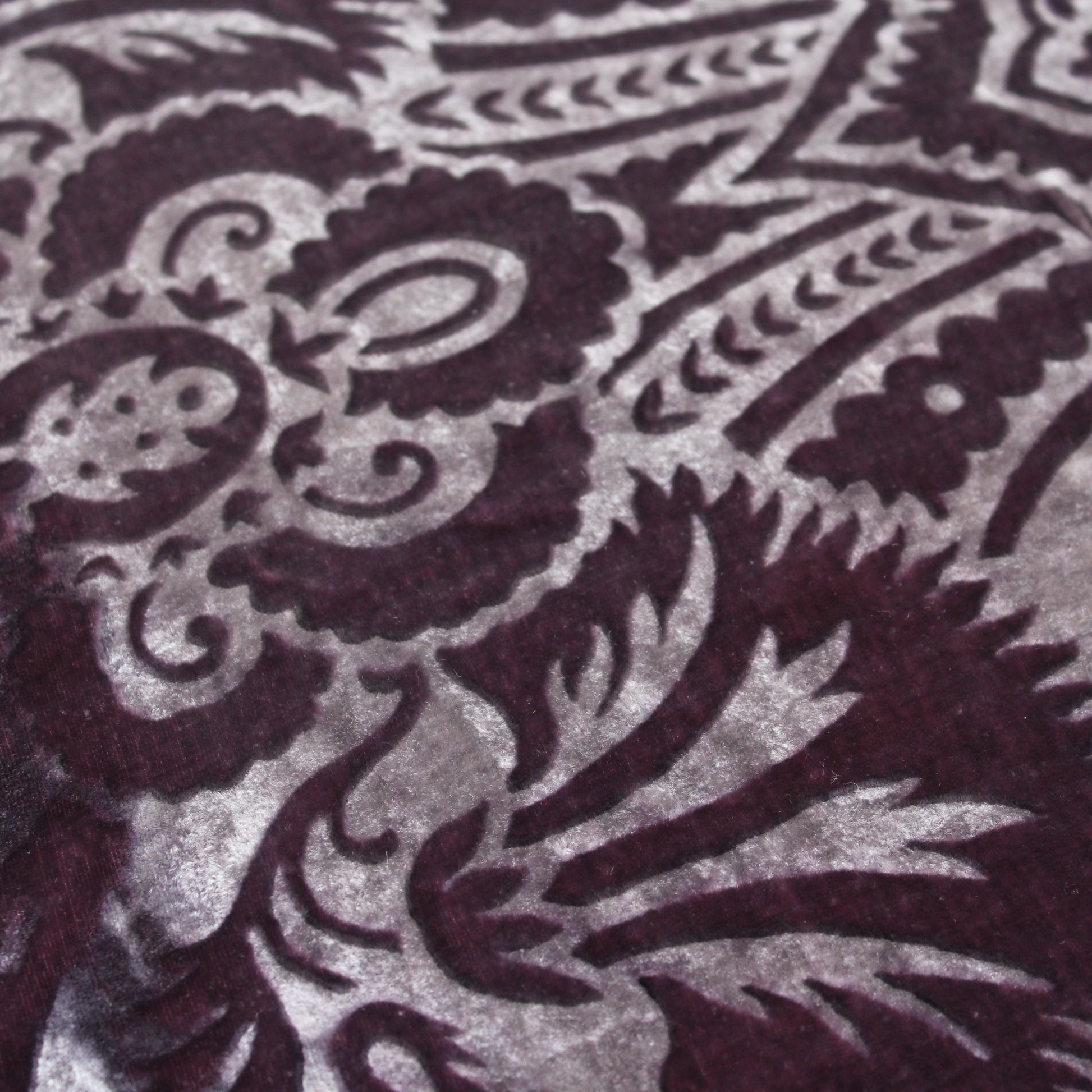Close up of gaufrage silk velvet cushion showing the pattern in the velvet.