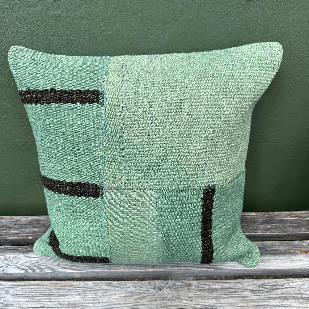 green dyed wool cushon