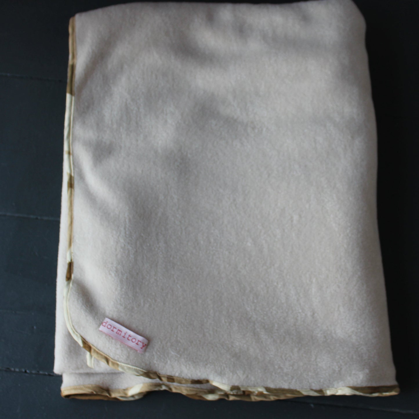 Camouflage edged fleece blanket in beige