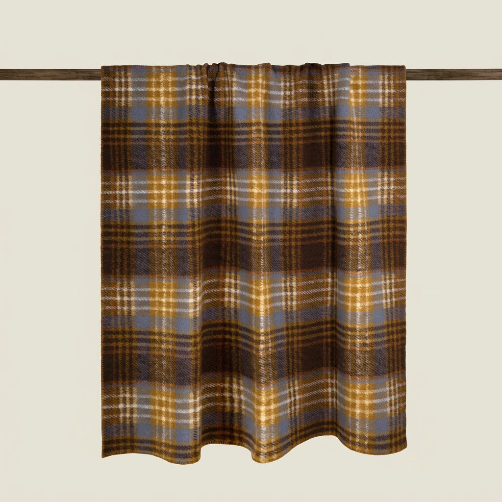 A plaid curtain panel hanging from a dark wooden rod against a solid light beige background. The plaid pattern features brown, mustard yellow, slate blue, and white stripes.