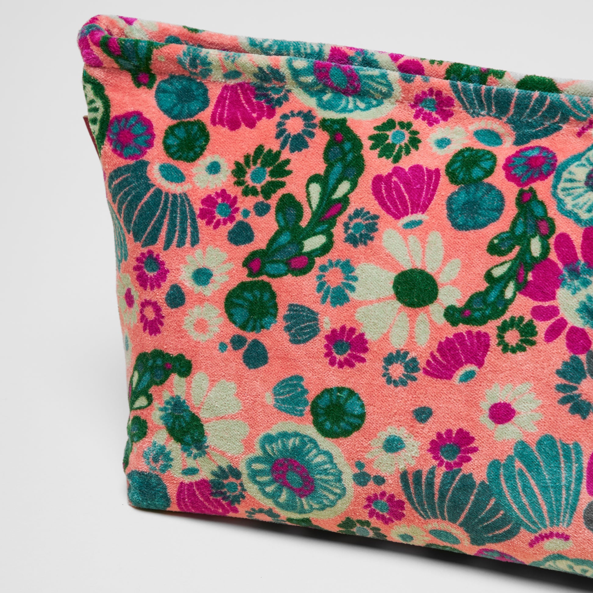 Cotton velvet light pink washbag with a teal, green and magenta floral design.