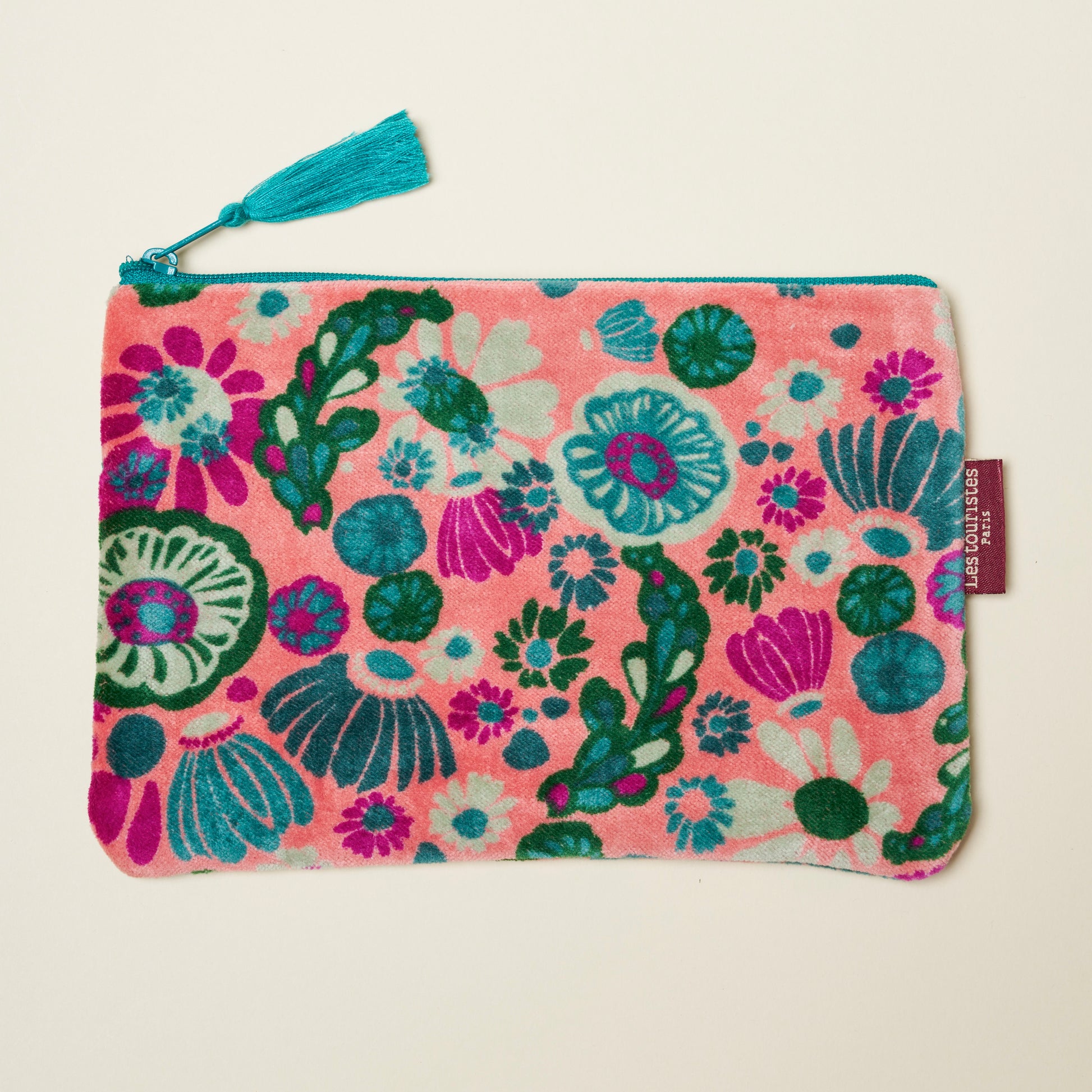 Cotton velvet pouch with a light pink base with teal, green and magenta floral design.