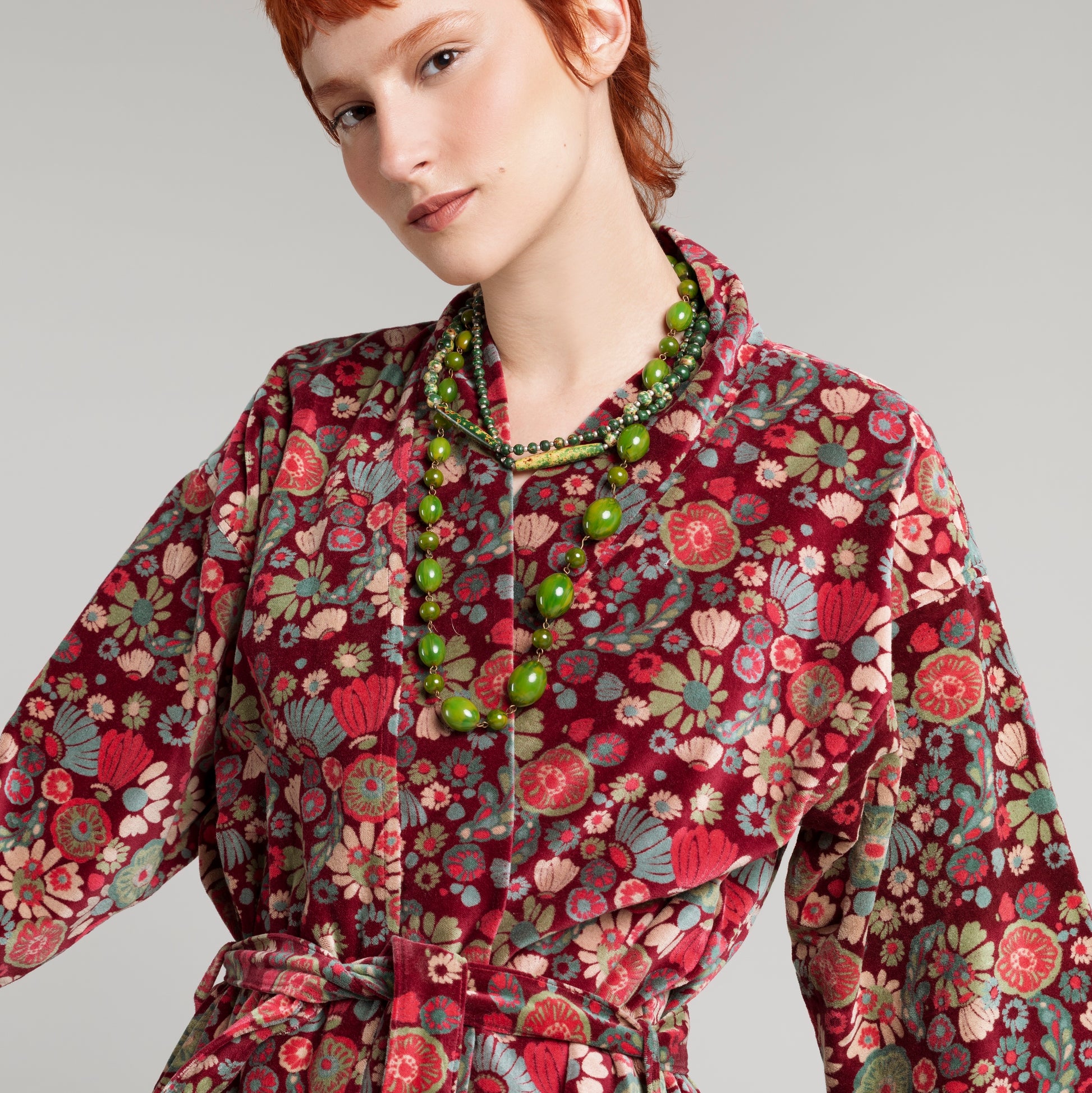 Cotton velvet burgundy robe with a teal, cream, magenta and green floral pattern.