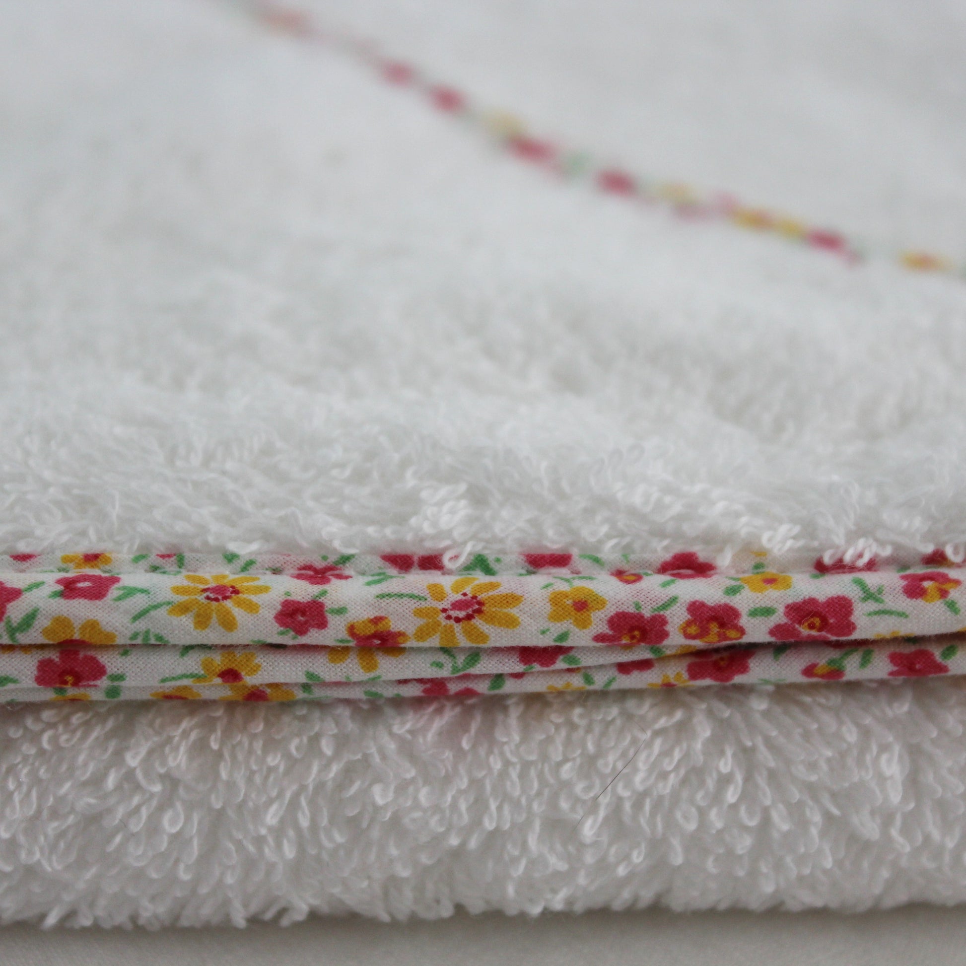Daisy floral trimmed hooded towel in soft wite cotton towelling
