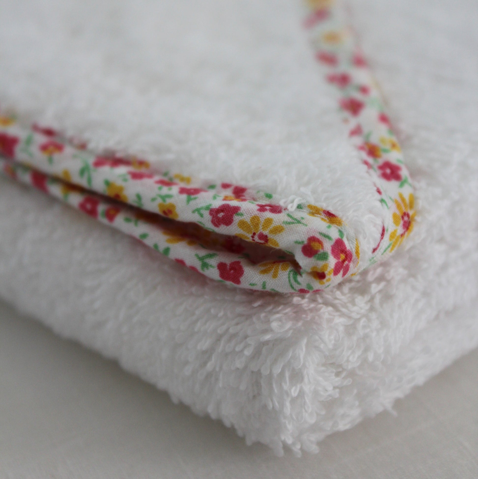Daisy floral trimmed hooded towel in soft wite cotton towelling