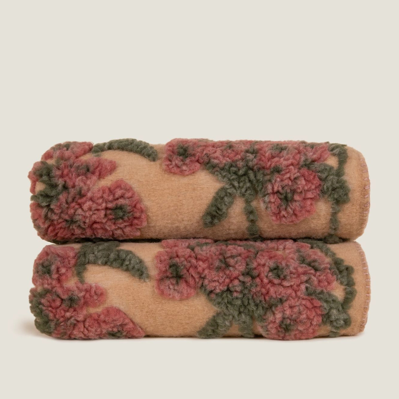 Old Flower boiled wool throw displayed folded, showing the blanket stitched edge.