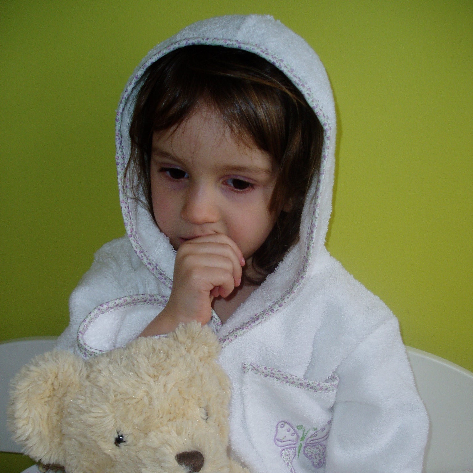 White towelling childs robe with ,lilac trim and butterfly applique