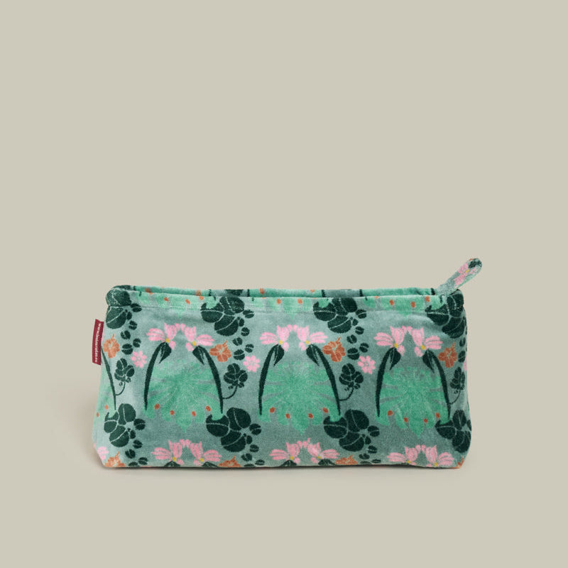 A small zippered pouch with a green floral pattern, featuring pink flowers and dark green leaves, set against a solid light beige background.