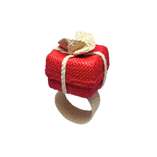 Red christmas present with white bow hand-made napkin ring.