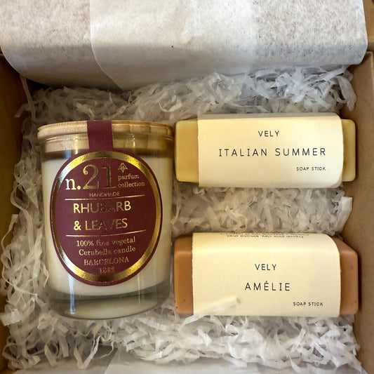 Small reusable gift box with a rhubarb and leaves votive candles and two soap sticks.