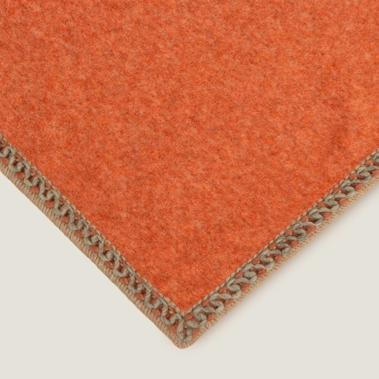 Braided edge to apricot bamboo throw.