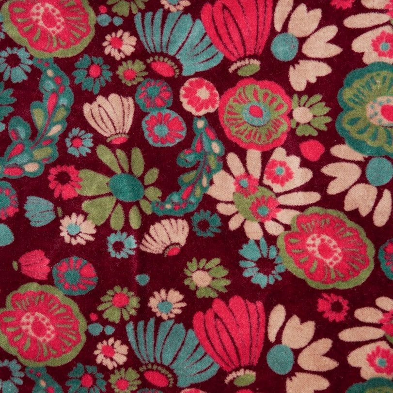 Burgundy cotton velvet with a teal, magenta, cream and green floral design.