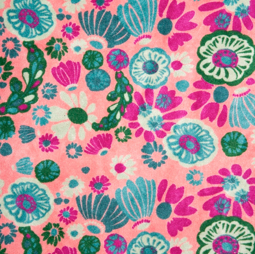 Light pink cotton velvet with a teal, green and magenta floral pattern.