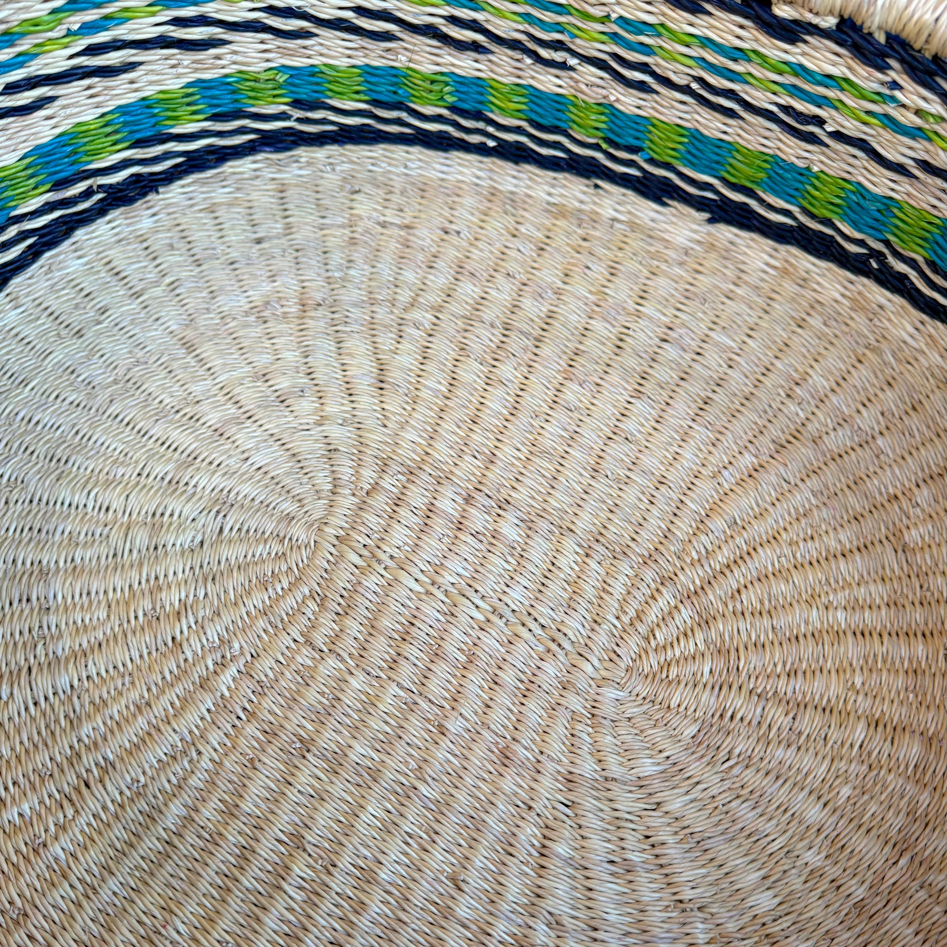 Inside of the woven tray showing the hand woven detailing.