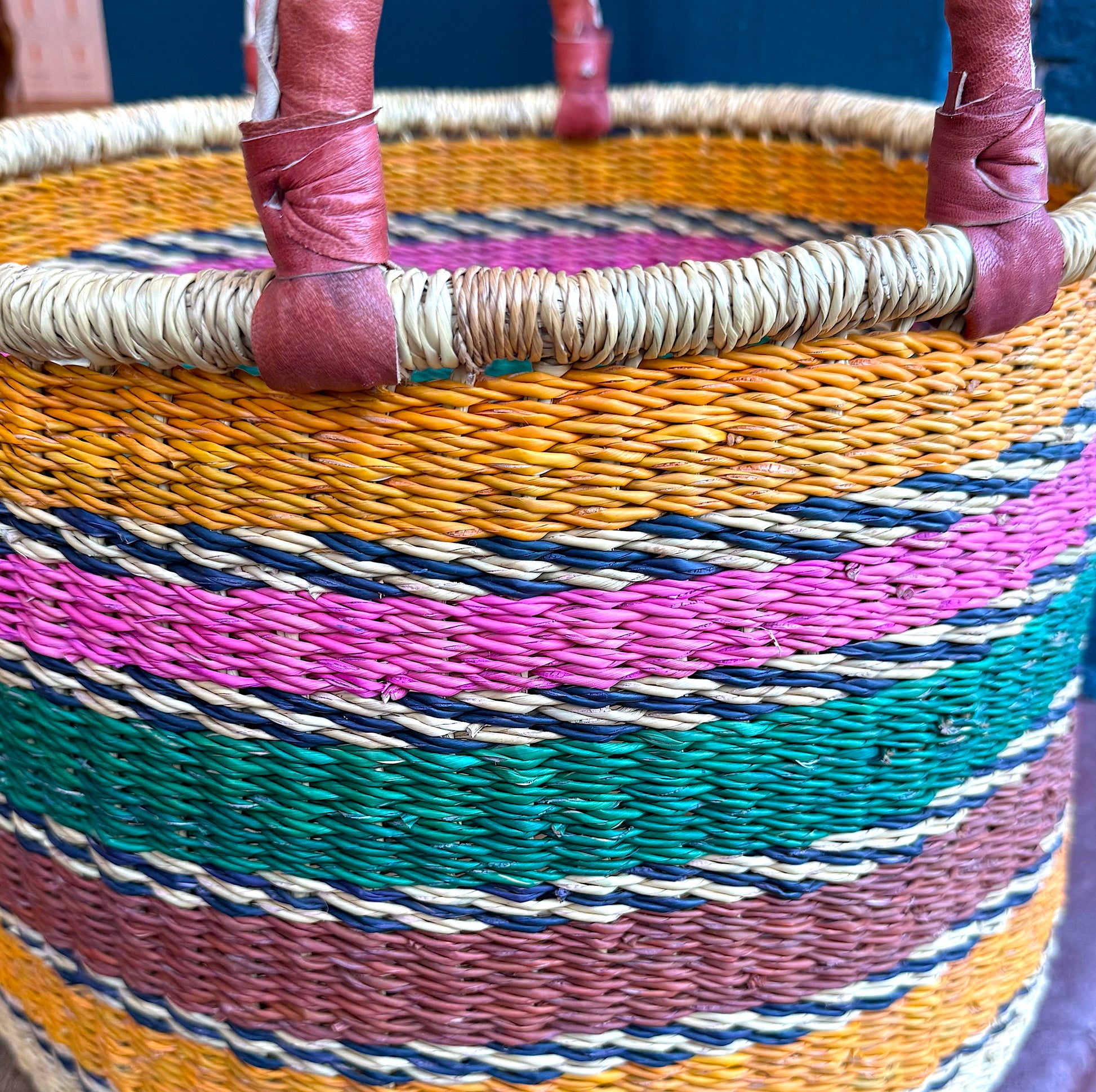 Ghanain Basket with leather handles in bright stripes.